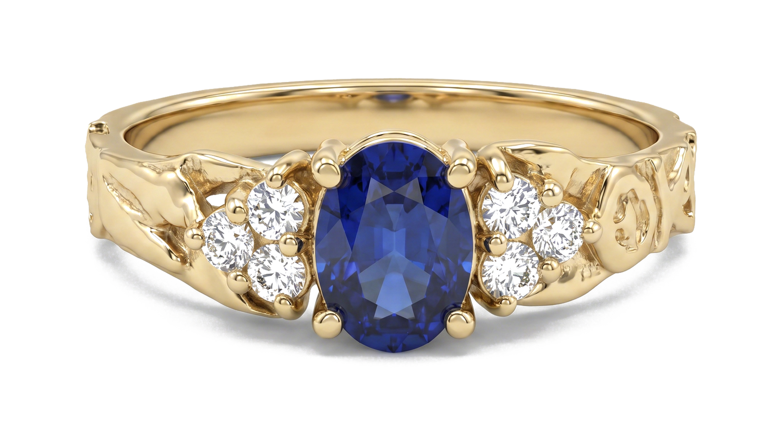 Anel Safira Floral — ouro 18k amarelo com safira azul oval e diamantes laterais em galeria gravada com motivos florais